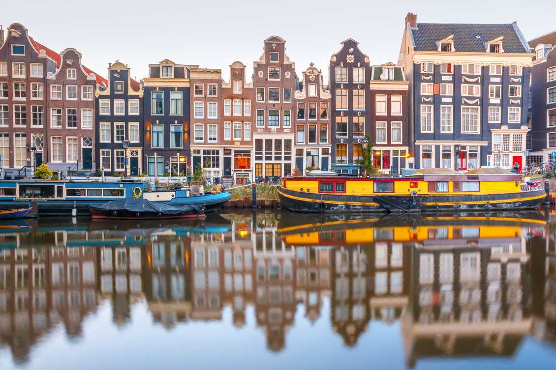 Picture of boats an a canal in Amsterdam. Source: Shutterstock